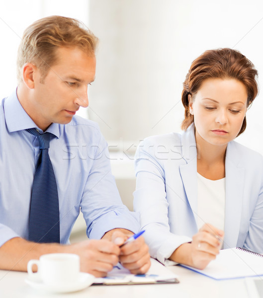Stock photo: business team discussing something in office