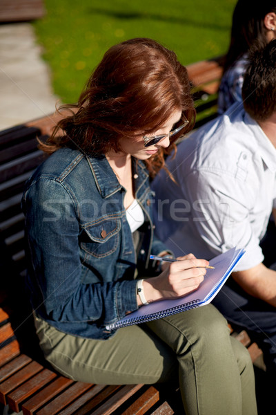 Stok fotoğraf: öğrenci · kız · yazı · defter · kampus · yaz