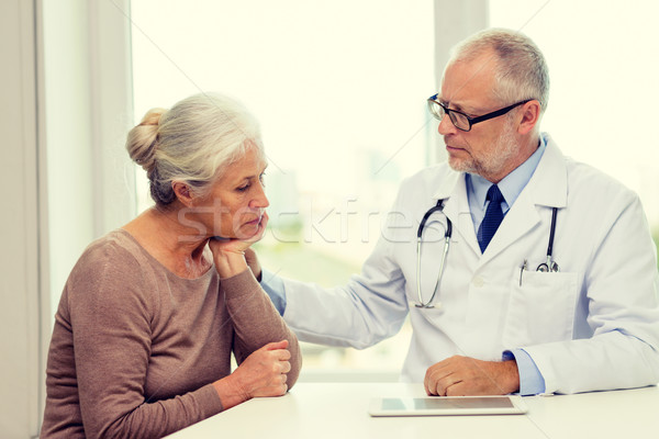 Stock photo: senior woman and doctor with tablet pc
