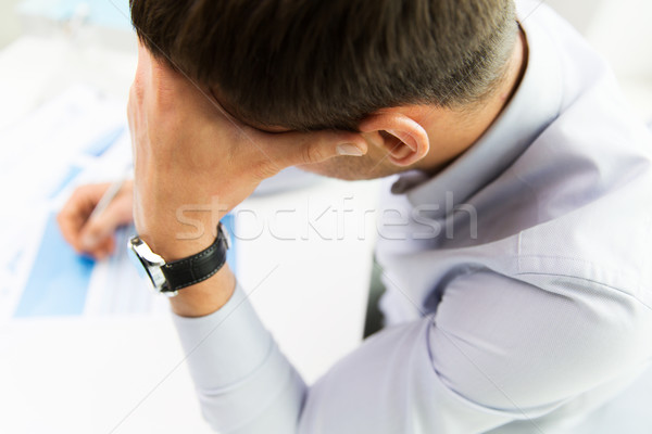 close up of businessman with laptop and papers Stock photo © dolgachov