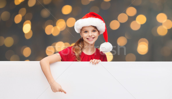 child in santa helper hat with blank white board Stock photo © dolgachov