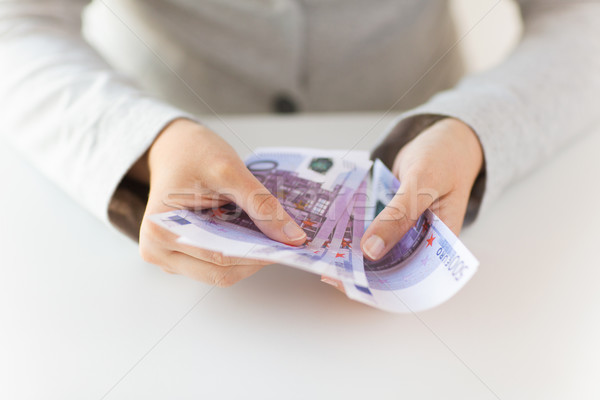 close up of woman hands counting euro money Stock photo © dolgachov