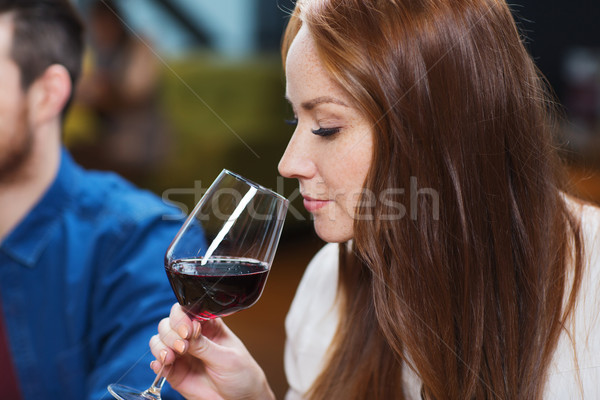 Mosolygó nő iszik vörösbor étterem szabadidő italok Stock fotó © dolgachov