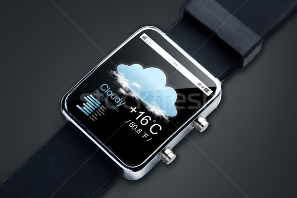 close up of smart watch with weather forecast app Stock photo © dolgachov