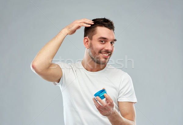 Gelukkig jonge man haren wax gel schoonheid Stockfoto © dolgachov