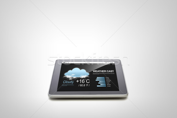 close up of tablet pc computer with weather cast Stock photo © dolgachov