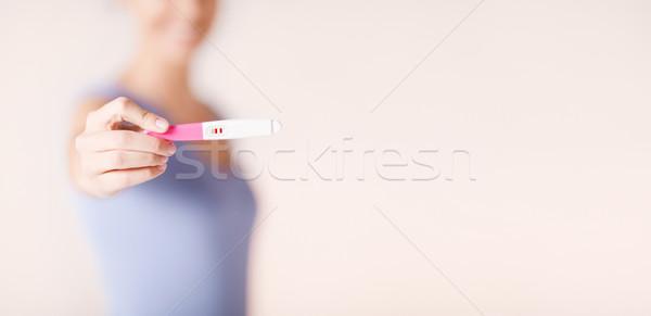 happy woman with pregnancy test Stock photo © dolgachov