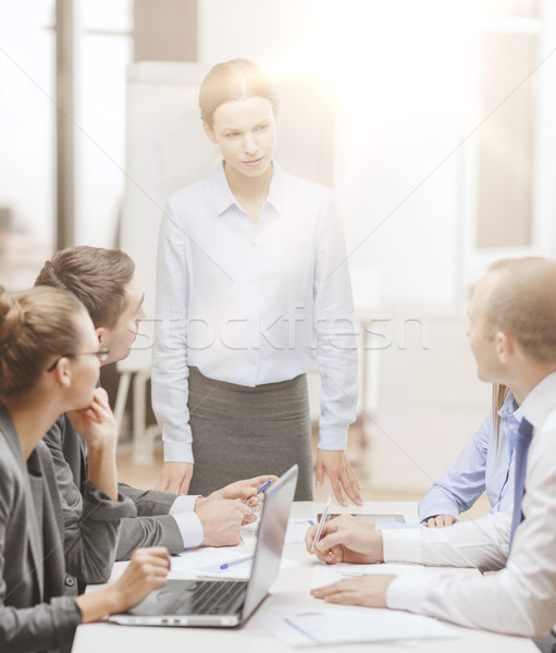 strict female boss talking to business team Stock photo © dolgachov