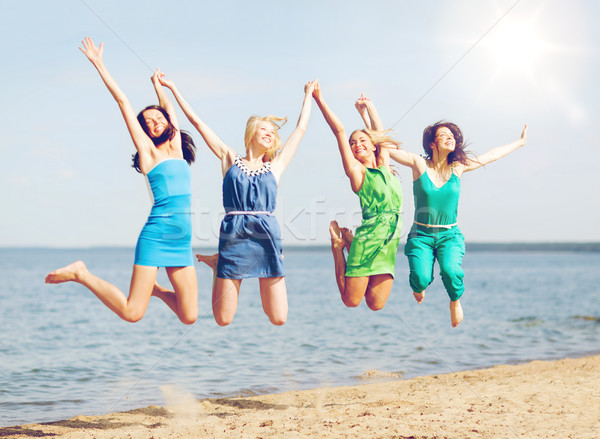 девочек прыжки пляж лет праздников отпуск Сток-фото © dolgachov