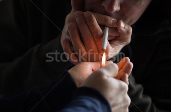 close up of young people smoking cigarette Stock photo © dolgachov
