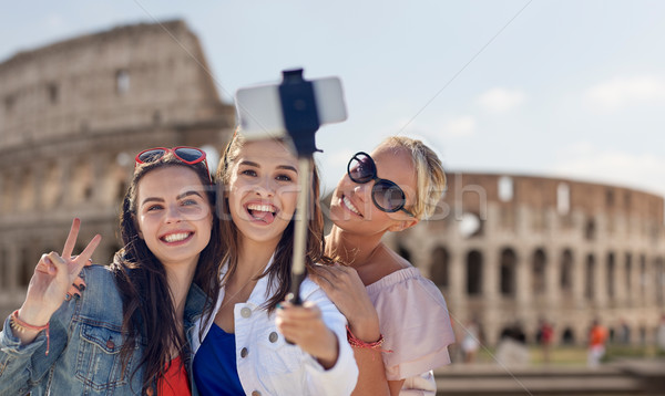 group of smiling women taking selfie in rome Stock photo © dolgachov
