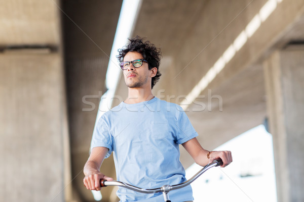 Jeunes homme équitation fixé engins [[stock_photo]] © dolgachov