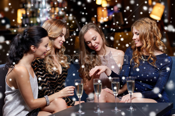 woman showing engagement ring to her friends Stock photo © dolgachov