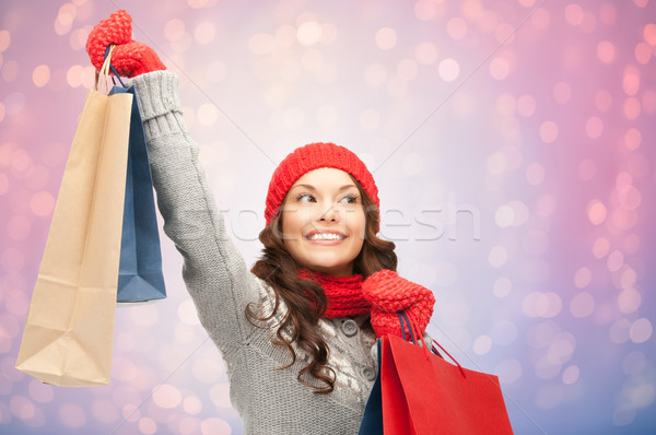 woman with shopping bags over christmas lights  Stock photo © dolgachov