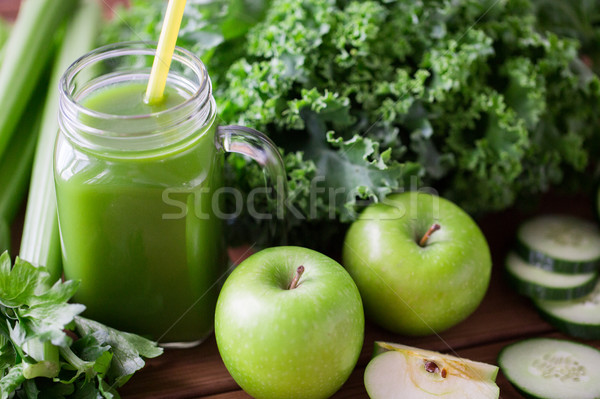 close up of jug with green juice and vegetables Stock photo © dolgachov