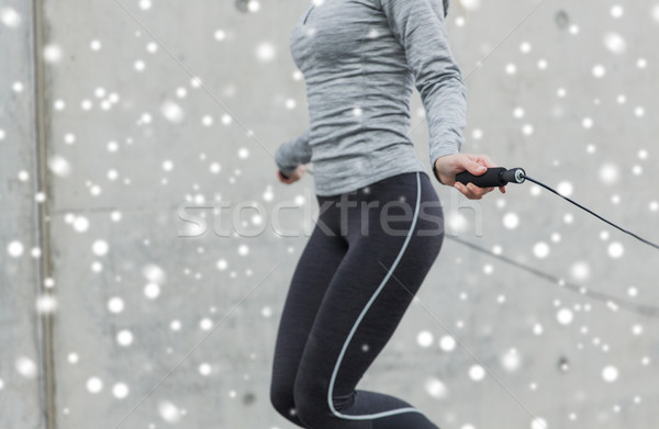close up of woman exercising with jump-rope Stock photo © dolgachov
