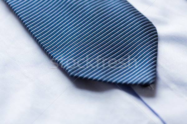 close up of shirt and blue patterned tie Stock photo © dolgachov