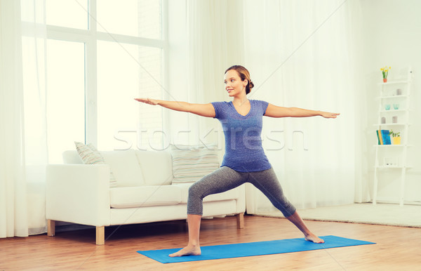 Nő készít jóga harcos póz fitnessz Stock fotó © dolgachov