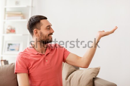 Stockfoto: Gelukkig · man · iets · denkbeeldig · home