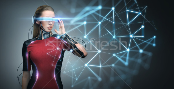 woman in virtual reality glasses and microchip Stock photo © dolgachov