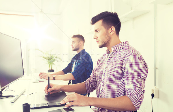 man or designer with computer and tablet at office Stock photo © dolgachov