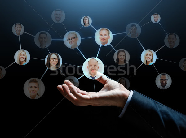 close up of businessman hand with contacts icons Stock photo © dolgachov