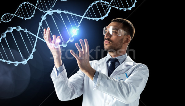 scientist in lab coat and safety glasses with dna Stock photo © dolgachov