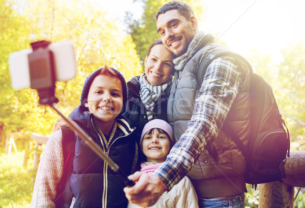 family with backpacks taking selfie and hiking Stock photo © dolgachov