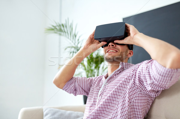 happy man with virtual reality headset at office Stock photo © dolgachov