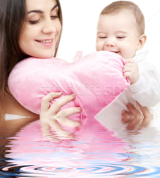 baby and mama with heart-shaped pillow Stock photo © dolgachov