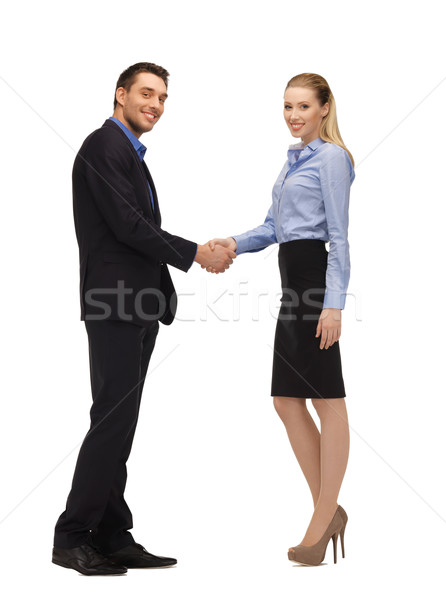 Stock photo: man and woman shaking their hands