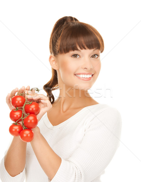 Stock photo: beautiful woman with shiny tomatoes