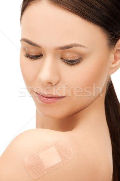 beautiful woman with medical patch or plaster Stock photo © dolgachov
