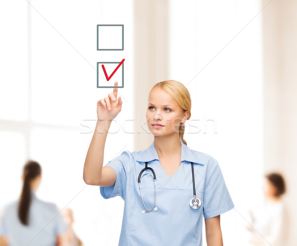 Gülen doktor hemşire işaret sağlık tıp Stok fotoğraf © dolgachov