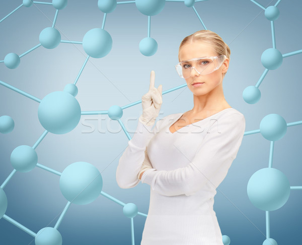 woman in protective glasses and gloves Stock photo © dolgachov