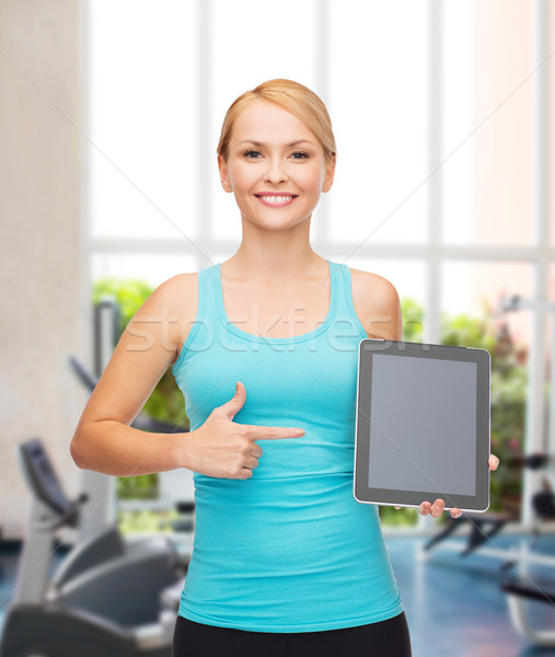 Stock photo: sporty woman with tablet pc blank screen