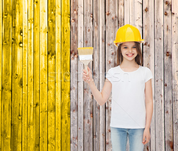 Lächelnd kleines Mädchen Helm Pinsel Malerei Gebäude Stock foto © dolgachov