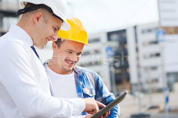 Sorridente construtores negócio edifício trabalho em equipe Foto stock © dolgachov