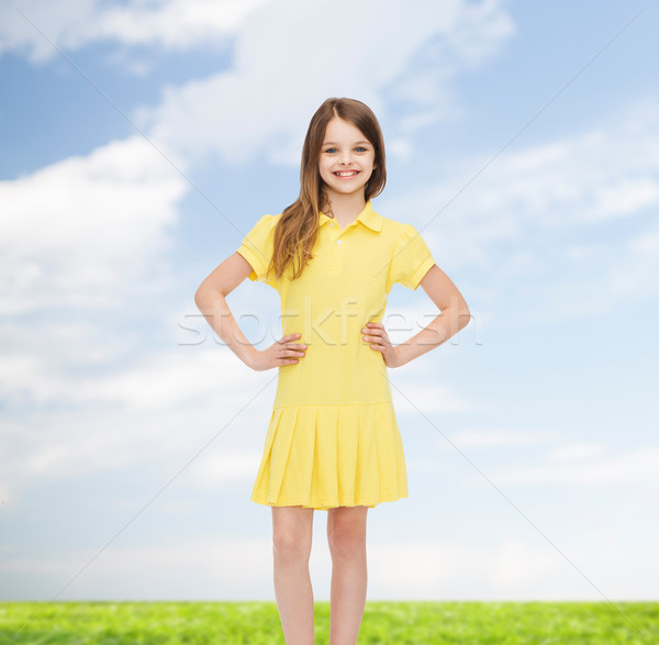 smiling little girl in yellow dress Stock photo © dolgachov