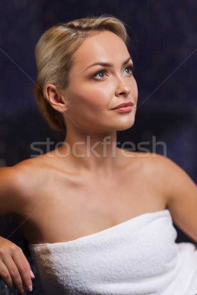 beautiful young woman sitting in bath towel Stock photo © dolgachov