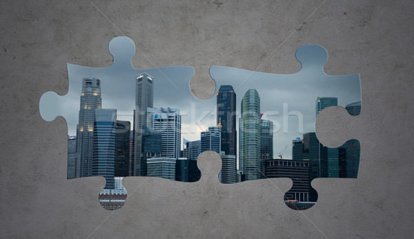 puzzle of city over gray concrete background Stock photo © dolgachov