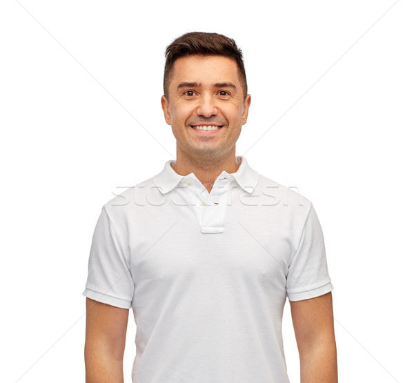 smiling man in white blank polo t-shirt Stock photo © dolgachov