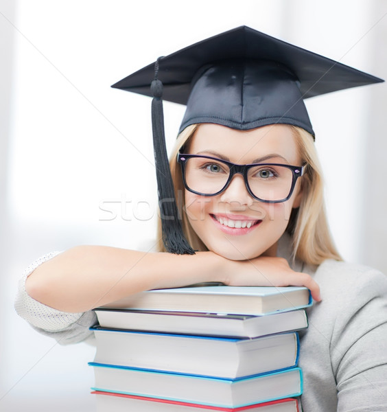 student in graduation cap Stock photo © dolgachov