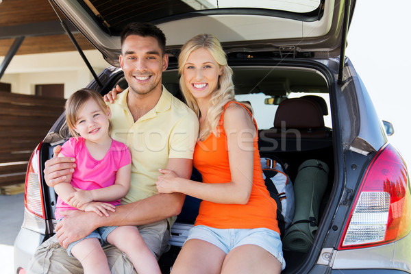 happy family with hatchback car at home parking Stock photo © dolgachov