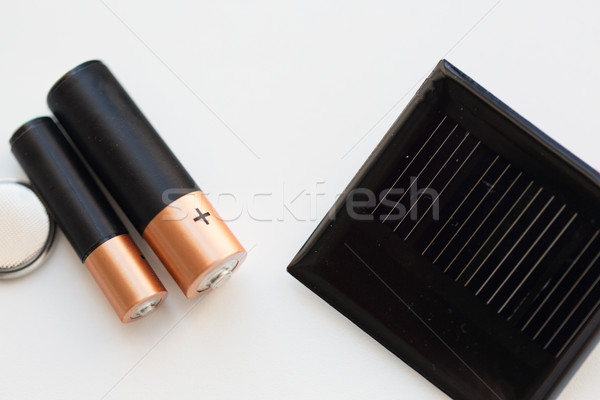 close up of alkaline batteries and solar cell Stock photo © dolgachov