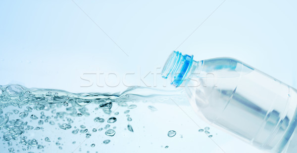 close up of plastic bottle with drinking water Stock photo © dolgachov