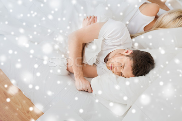 Stock photo: couple sleeping in bed at home