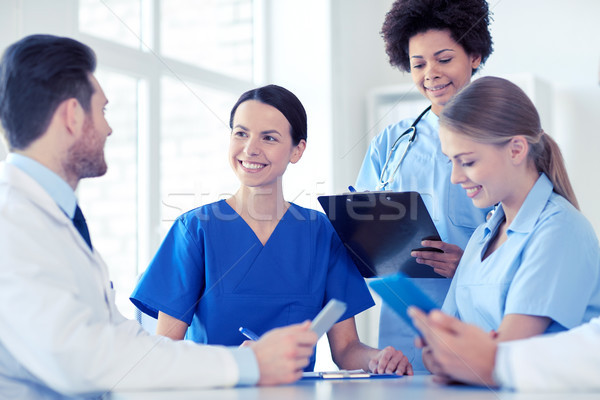 group of happy doctors meeting at hospital office Stock photo © dolgachov