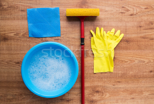 basin with cleaning stuff on wooden background Stock photo © dolgachov