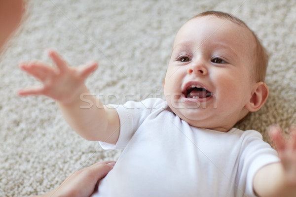 close up of happy little baby and mother Stock photo © dolgachov